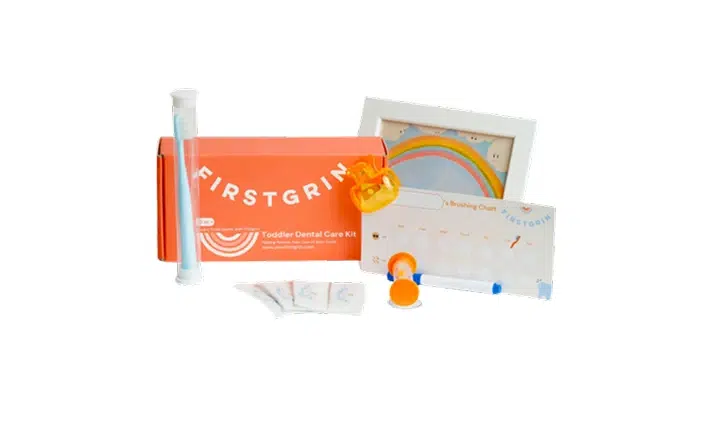 Smile Lodge craft supplies and materials arranged on white background including orange banner and wooden pieces.