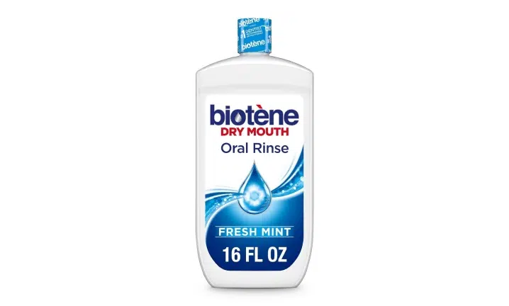 Biotene Dry Mouth Oral Rinse bottle, 16 fl oz, fresh mint flavor on white background.
