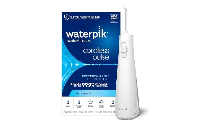 Waterpik Cordless Pulse water flosser product box and white device displayed against blue background.