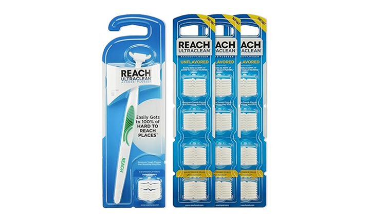 Reach dental floss product display showing handle dispenser and refill cartridges on white background.